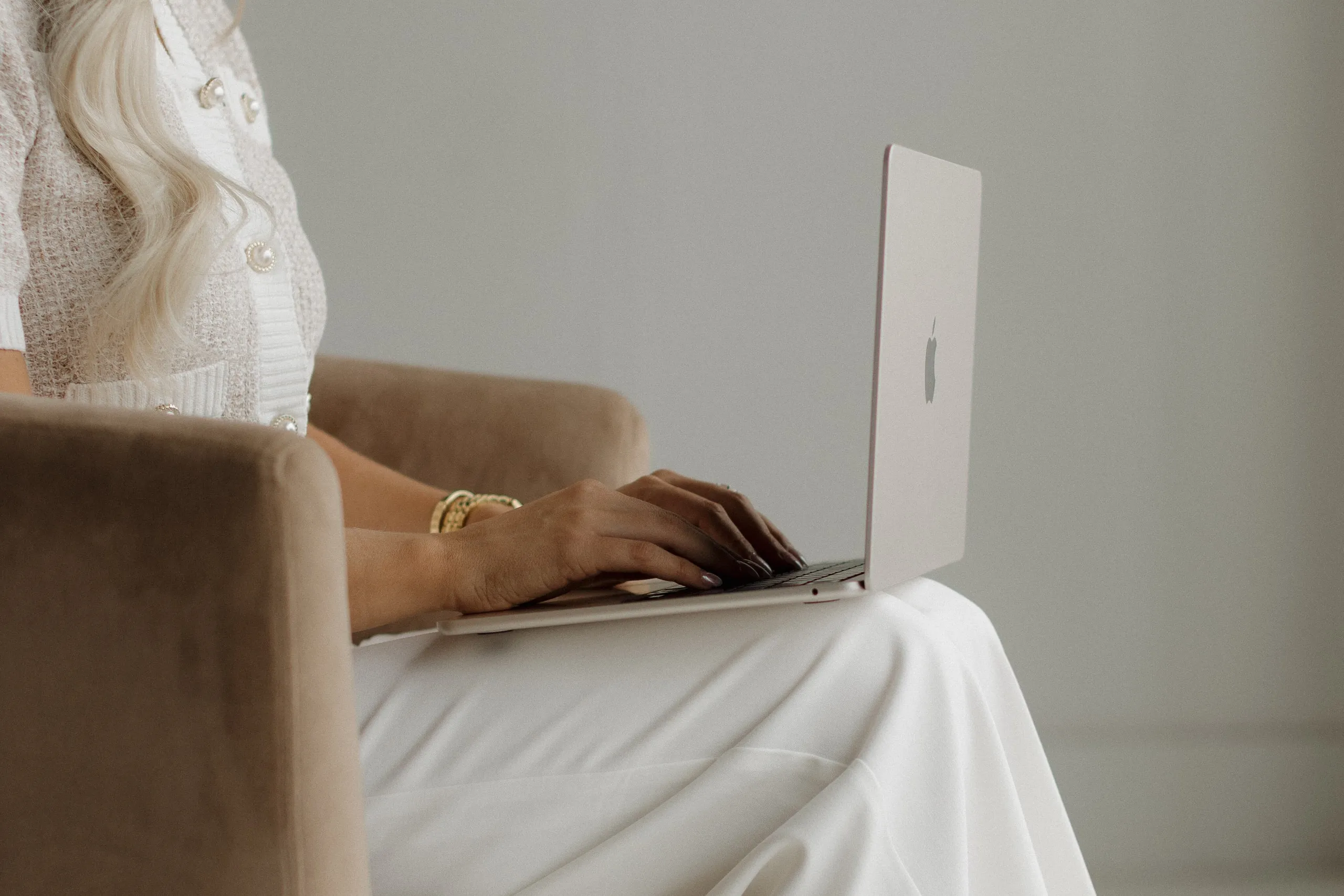 Marissa Lubera writing at her laptop